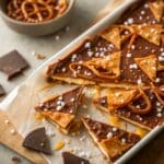 Salted caramel pretzel bark broken into crunchy, glossy pieces